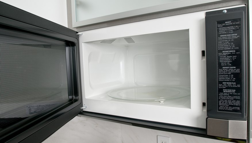 Open microwave oven in kitchen