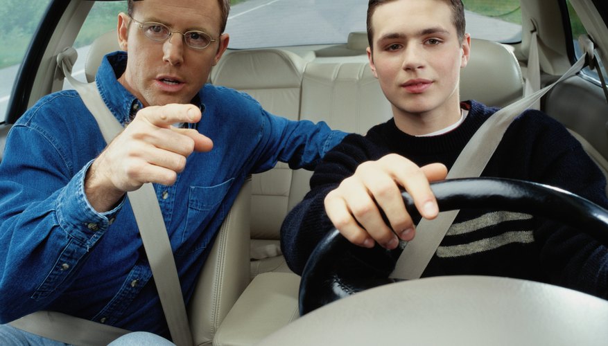 Man Teaching a Boy How to Drive