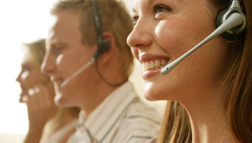 Smiling woman wearing telephone headset