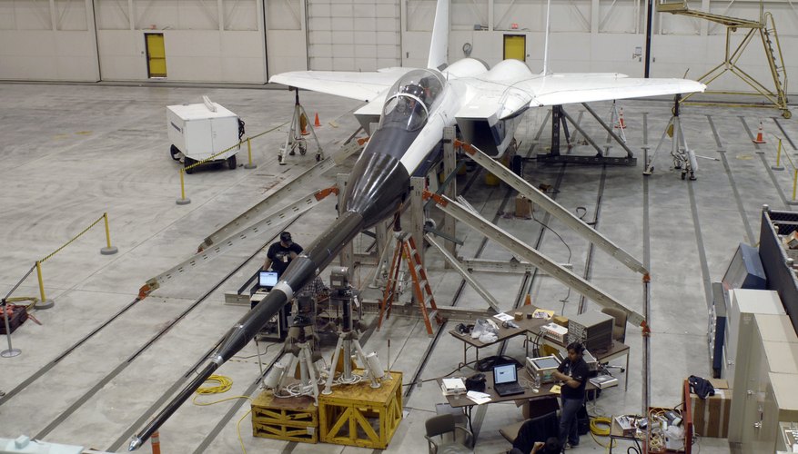 An F-15B testbed aircraft undergoes ground vibration testing.