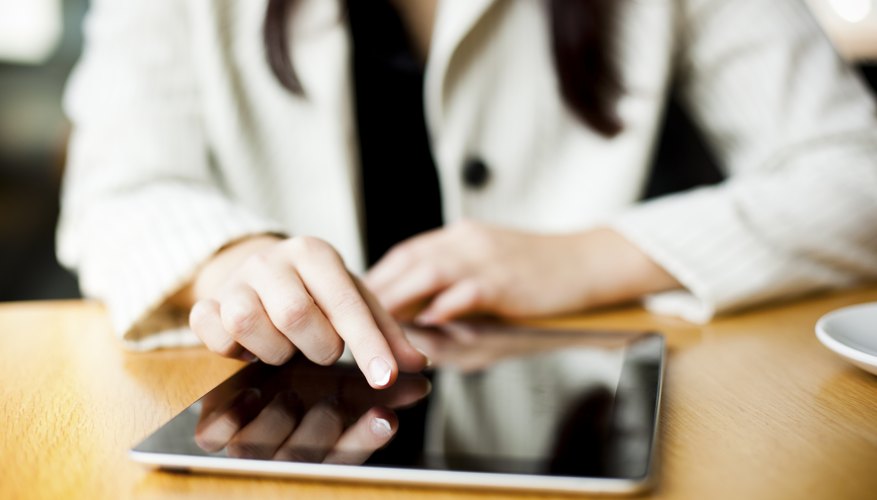 Photo Credit: visualspace/iStock/Getty Images A close-up of a woman reading her tablet computer.