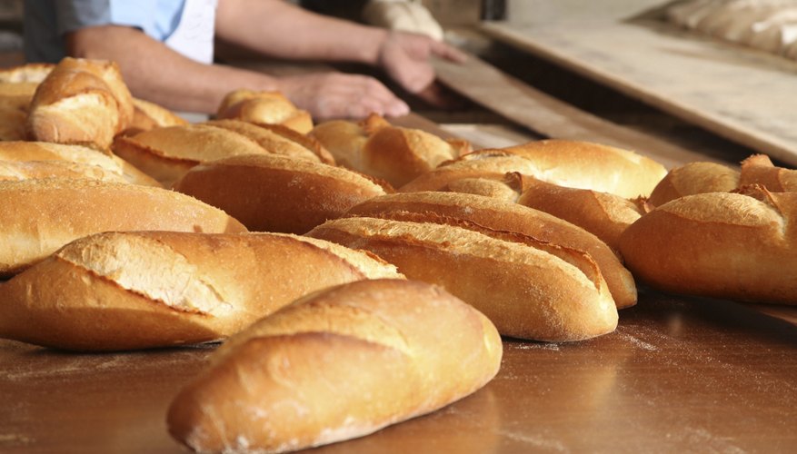 A baker makes fresh bread. A baker makes fresh bread.