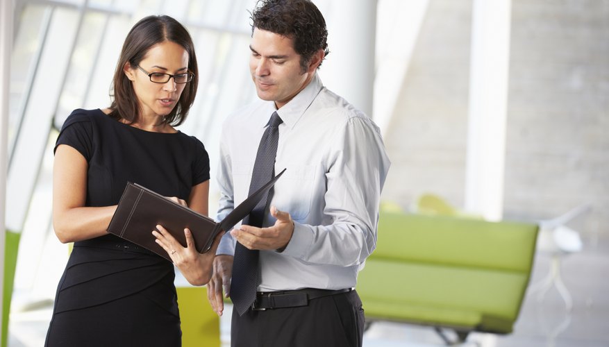Businessman And Businesswomen Having Meeting In Office