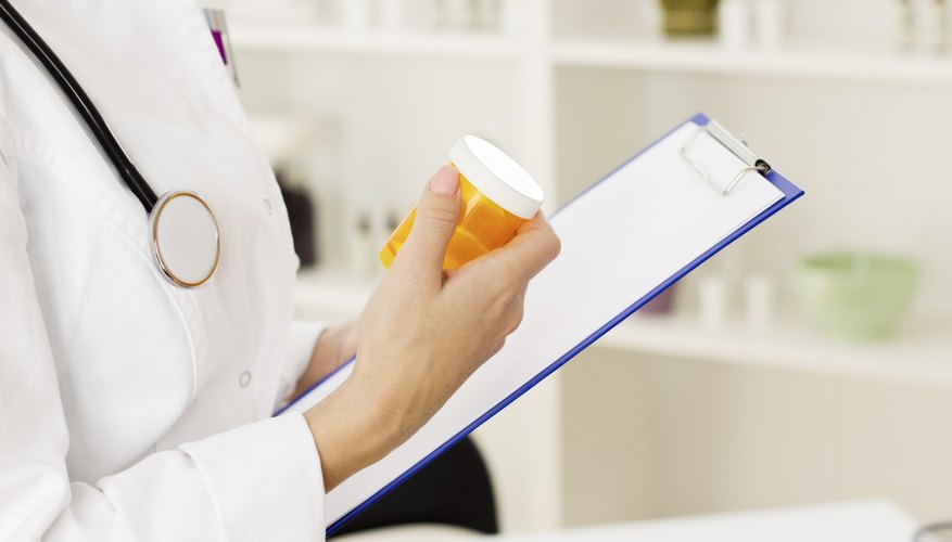 Doctor writing prescription. Doctor writing prescription.