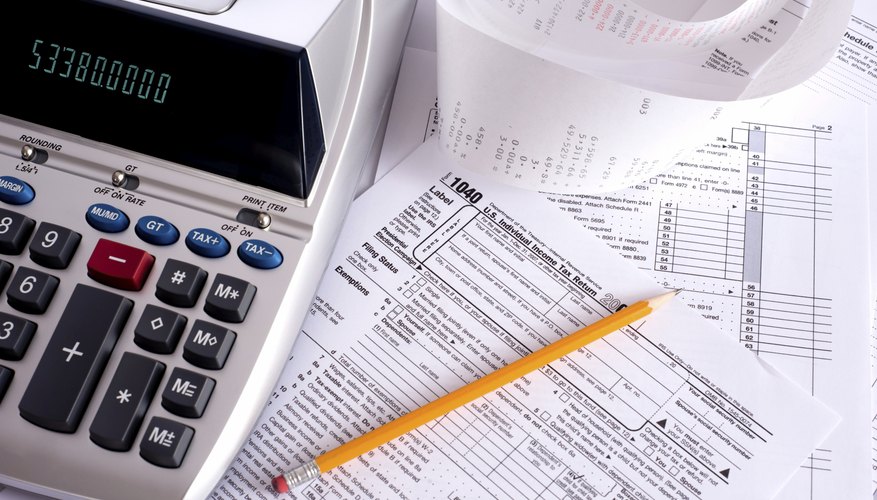 Calculator on top of tax papers