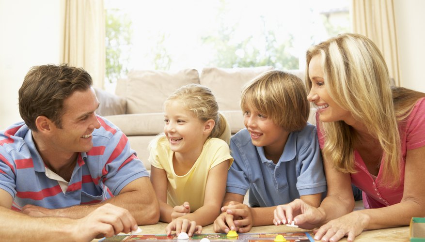 Family playing board game Family playing board game