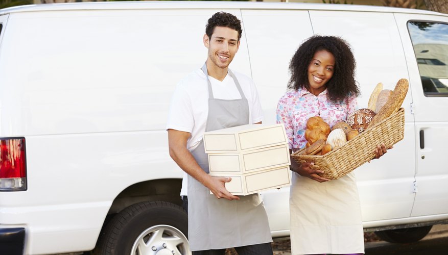 Bakers Unloading Bread And Cakes From Van