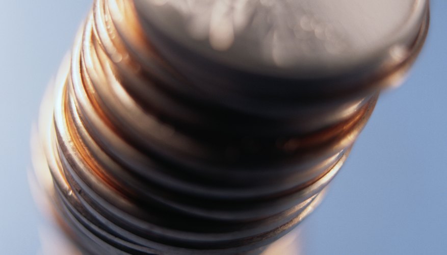 Photo Credit: Ryan McVay/Photodisc/Getty Images Combining certain elements with heat causes color changes on a penny.
