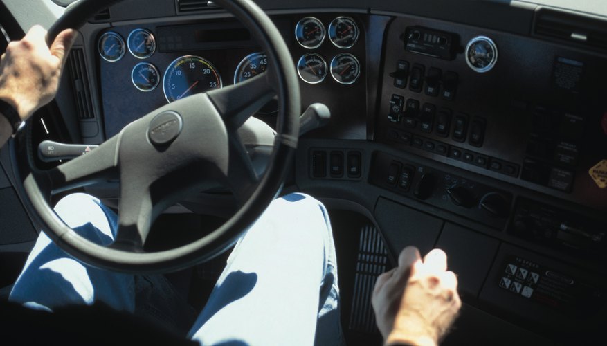 Interior view of man driving truck