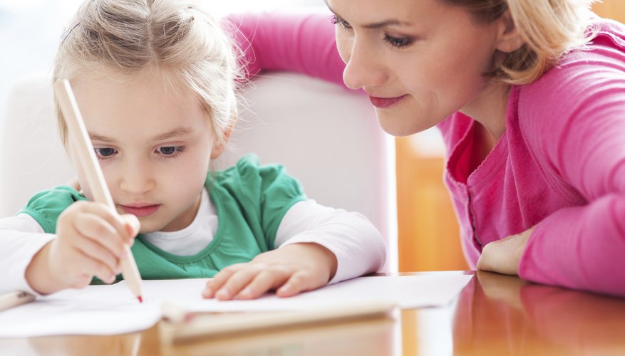 A teacher working with her student. A teacher working with her student.