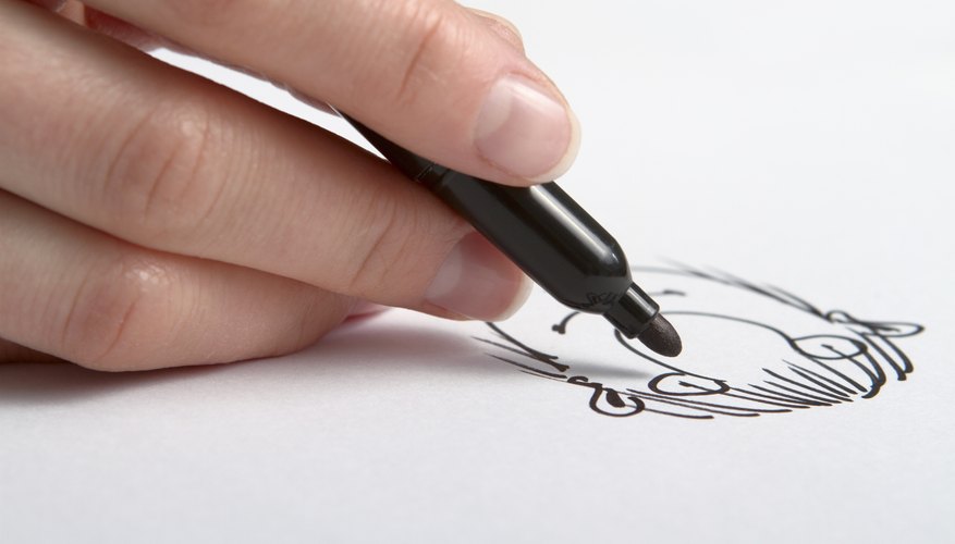 Photo Credit: Maksym Kravtsov/iStock/Getty Images Close-up of hand drawing cartoon