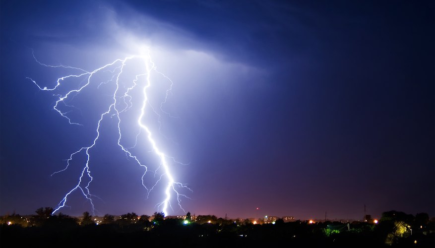 Lightning stikes over a small town. Lightning stikes over a small town.