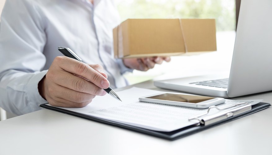 Midsection Of Businessman Working At Desk In Office