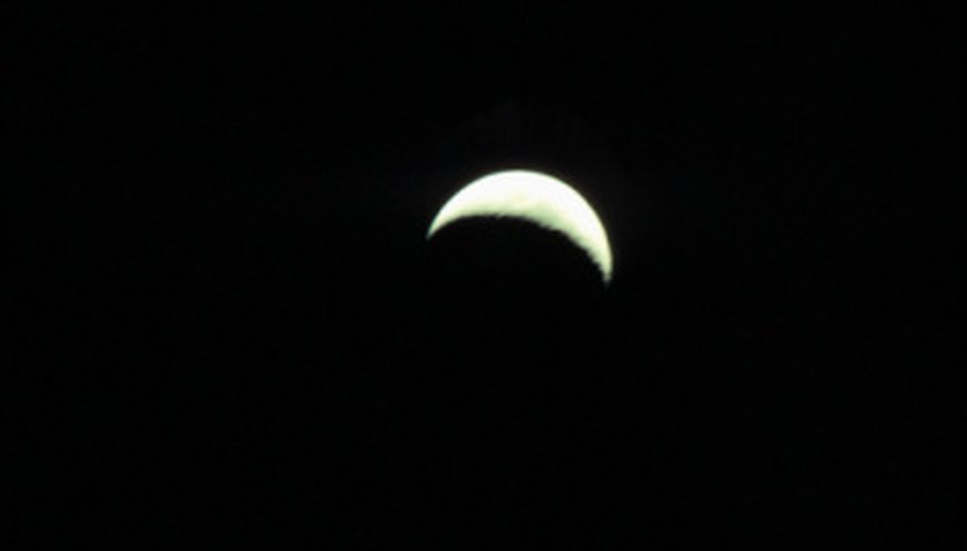 Photo Credit: Hemera Technologies/AbleStock.com/Getty Images A sliver of the moon is visible in a crescent moon.