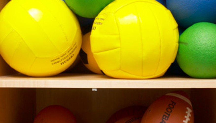 Photo Credit: Hemera Technologies/AbleStock.com/Getty Images Volleyballs are spherical; footballs are not.