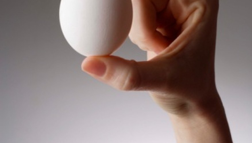 Photo Credit: Jupiterimages/Goodshoot/Getty Images Make the eggs less appealing to your dog.
