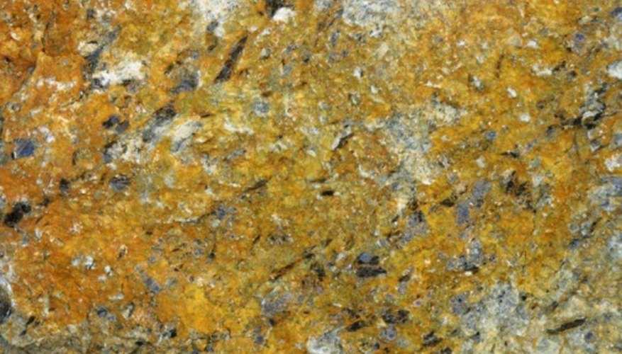 Photo Credit: Photos.com/Photos.com/Getty Images Gold is a heavy metal, resistant to weathering.