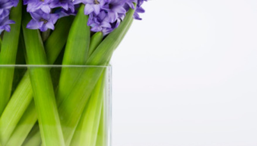 Photo Credit: Jupiterimages/Polka Dot/Getty Images A simple glass vase will put the focus on the flowers' beauty.