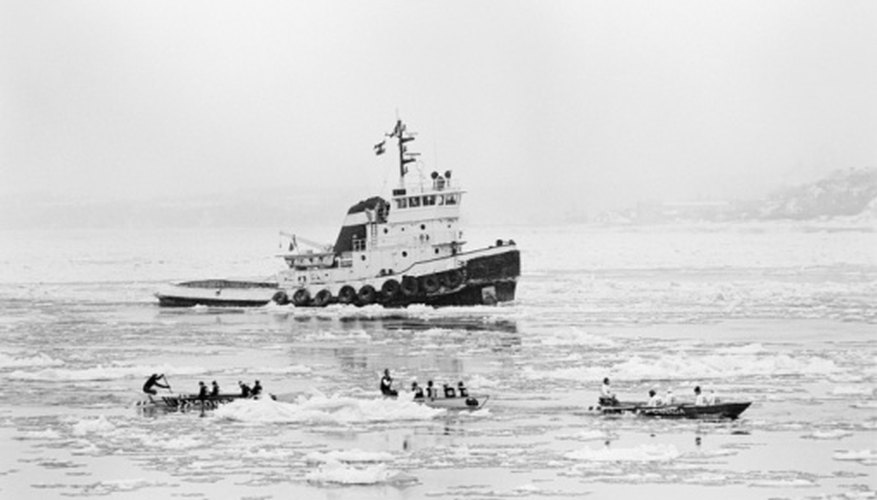 Photo Credit: Photos.com/AbleStock.com/Getty Images Ships stay afloat on large bodies of water due to the water's buoyant force.