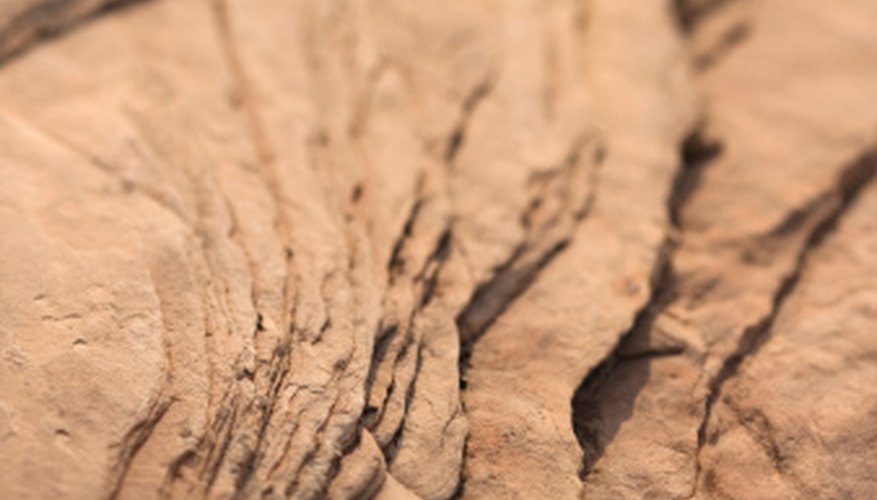 Photo Credit: Thinkstock/Comstock/Getty Images Divergent plate boundaries build new rock by letting magma bubble through the crust.