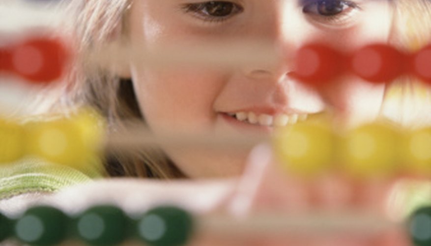 Photo Credit: Brand X Pictures/Brand X Pictures/Getty Images This is a girl learning to add.