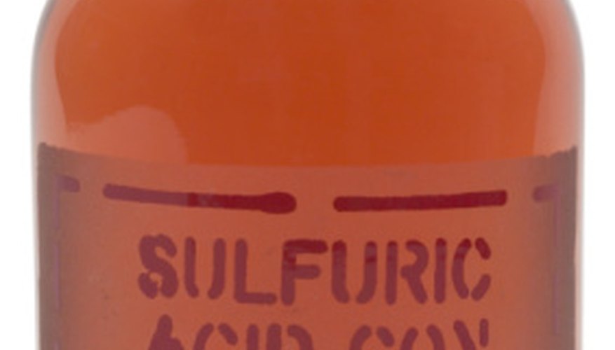 Photo Credit: Hemera Technologies/PhotoObjects.net/Getty Images Sulfuric acid and a base like potassium hydroxide will react by neutralizing each other.
