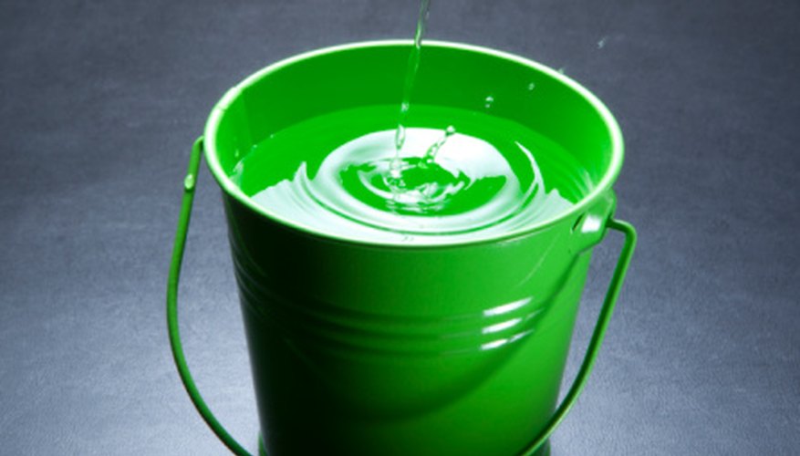 Photo Credit: Yasuhide Fumoto/Photodisc/Getty Images Empty water out of a bucket to determine gallons pumped per minute.