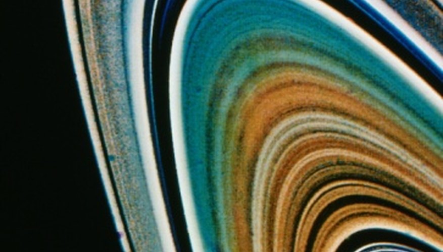 Photo Credit: Jupiterimages/Photos.com/Getty Images It is still a mystery to scientists as to how Saturn came to have its famous rings.