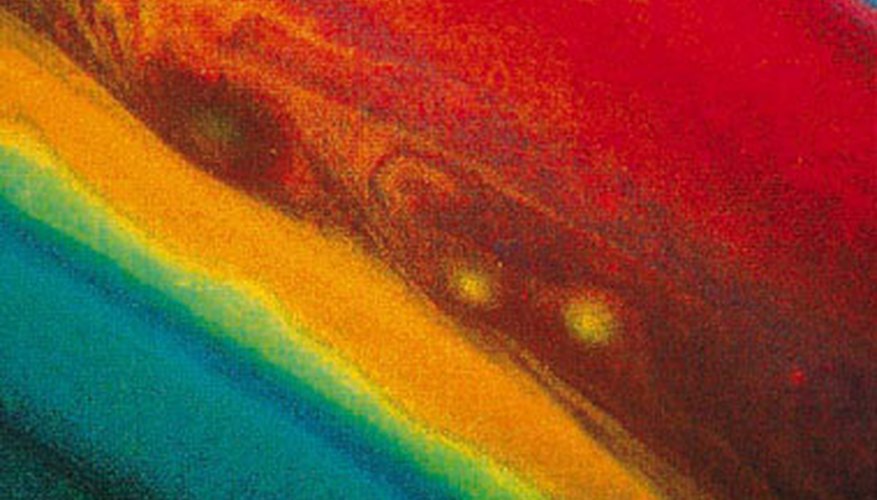 Photo Credit: Digital Vision./Digital Vision/Getty Images The gases that make up Saturn's atmosphere create a beautiful array of colors.