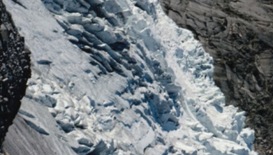 Photo Credit: Jupiterimages/Photos.com/Getty Images An avalanche is just one of the potential hazards faced in mountainous regions that are not a danger in other areas of the globe.