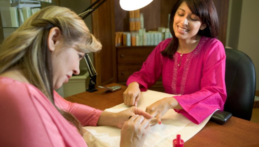 Photo Credit: Jupiterimages/Photos.com/Getty Images A beauty salon client may indicate satisfaction through facial expressions.
