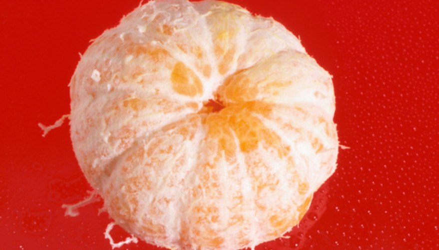 Photo Credit: Hemera Technologies/AbleStock.com/Getty Images Remove the peel from the orange.