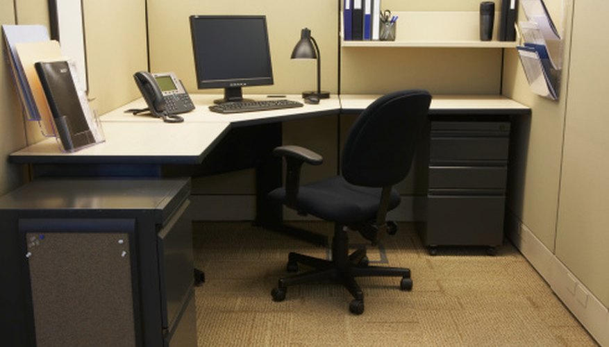 Photo Credit: Thomas Northcut/Digital Vision/Getty Images The workstation should provide ample room for the multiple tasks and include a swivel chair.