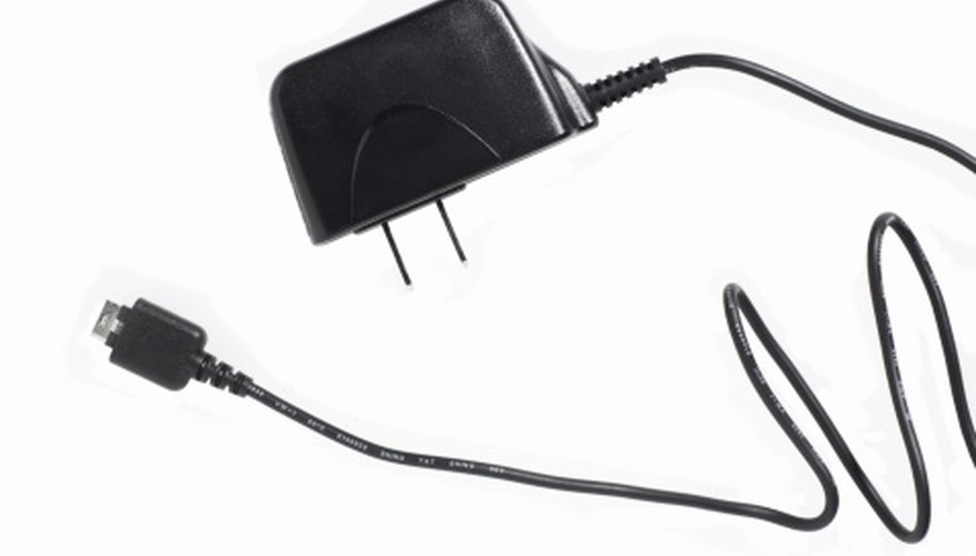 Photo Credit: Ryan McVay/Photodisc/Getty Images A cell phone adapter contains both a transformer and a rectifier.