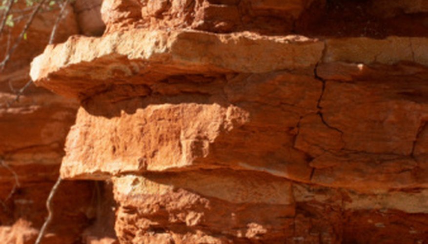 Photo Credit: Jupiterimages/Photos.com/Getty Images Sandstone gradually breaks down to sand.