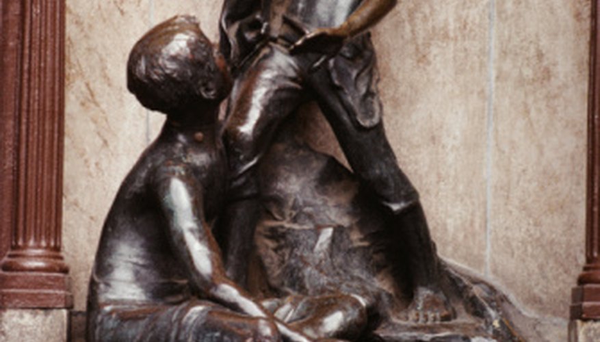 Photo Credit: Jupiterimages/Photos.com/Getty Images Bronze statues are often covered by a dark patina that protects the bronze.