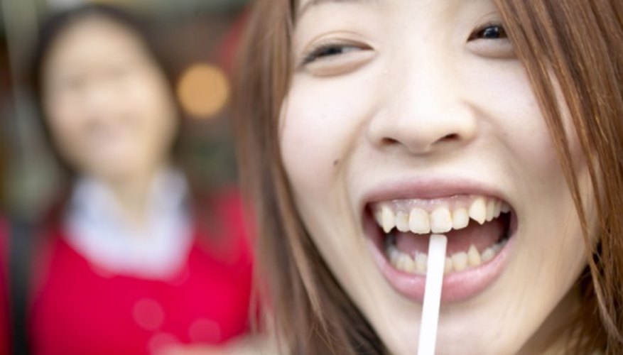 Photo Credit: Jupiterimages/Photos.com/Getty Images Humans have between six and 30 types of bacteria in their mouths.