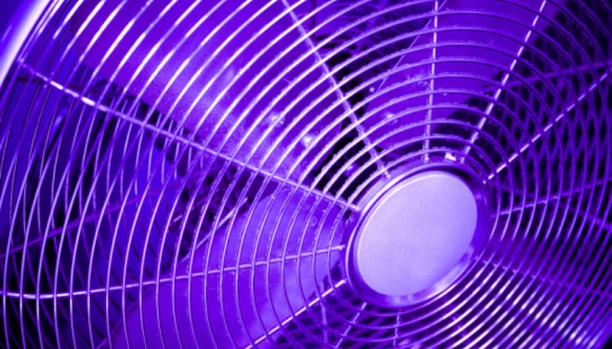 Photo Credit: Jupiterimages/Photos.com/Getty Images A more powerful fan displaces more air.