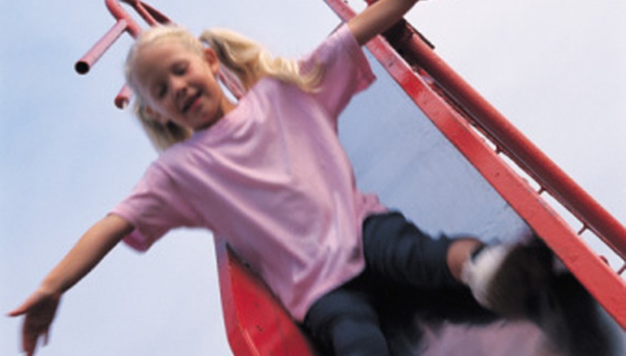 Photo Credit: Goodshoot/Goodshoot/Getty Images Playground slides are governed by the laws of physics.
