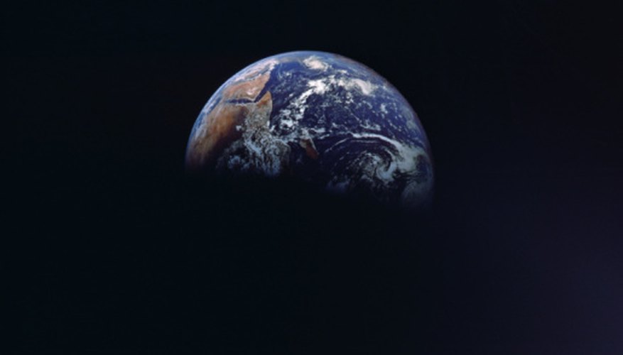 Photo Credit: Jupiterimages/Photos.com/Getty Images The four seasons occur because of the tilt of the Earth's axis as it orbits the sun.