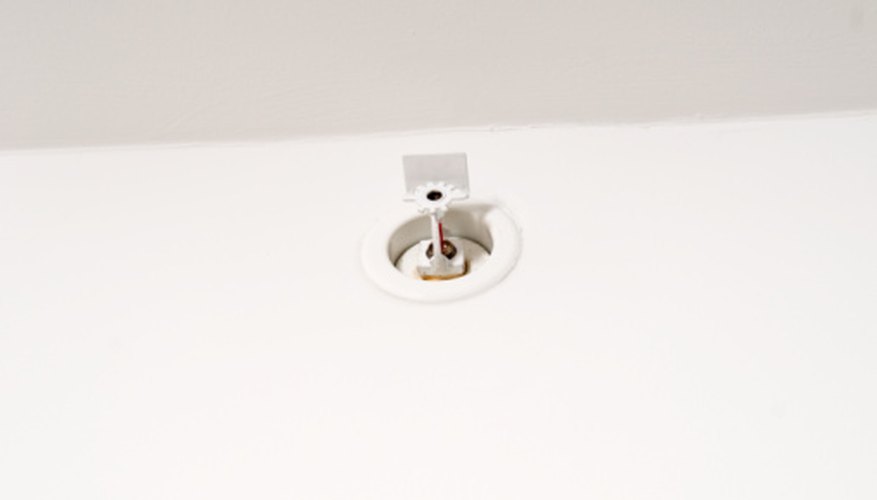 Photo Credit: Jupiterimages/Photos.com/Getty Images Sprinklers need a sufficiently high flow to effectively guard against fires.