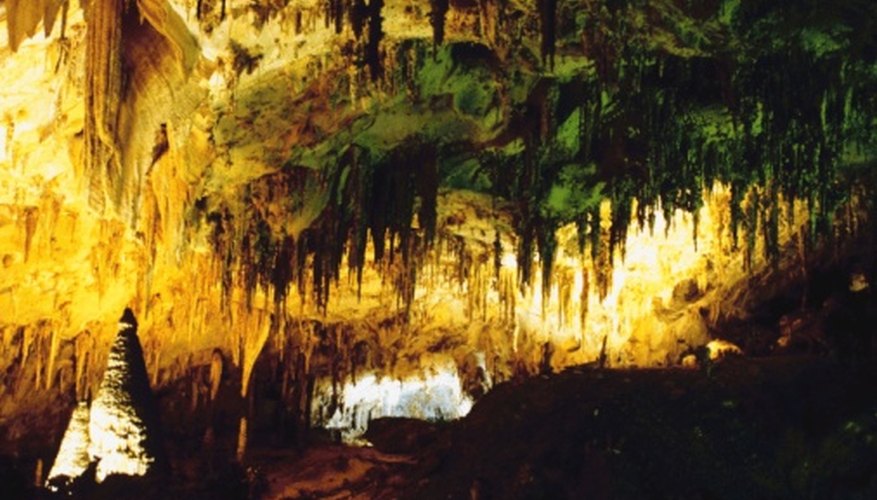 Photo Credit: Jupiterimages/Photos.com/Getty Images Formations of calcite stalagmites and stalagtites in a cave.