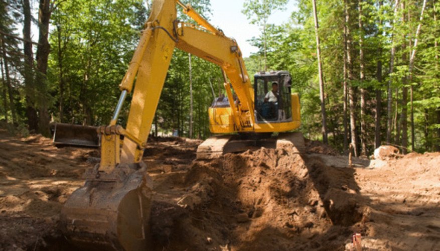 Photo Credit: Jupiterimages/Photos.com/Getty Images Many machines rely on hydraulic systems despite their disadvantages.