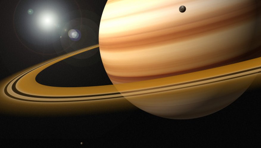 Photo Credit: Jason Reed/Photodisc/Getty Images Saturn's rings are wide, but not very thick.