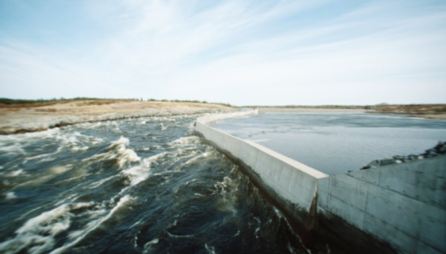 Photo Credit: Photos.com/Photos.com/Getty Images Many regions bordered by water bodies are protected by dams.