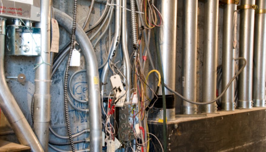 Photo Credit: Jupiterimages/Photos.com/Getty Images A mess of wires and conduits is a sign of substandard work.