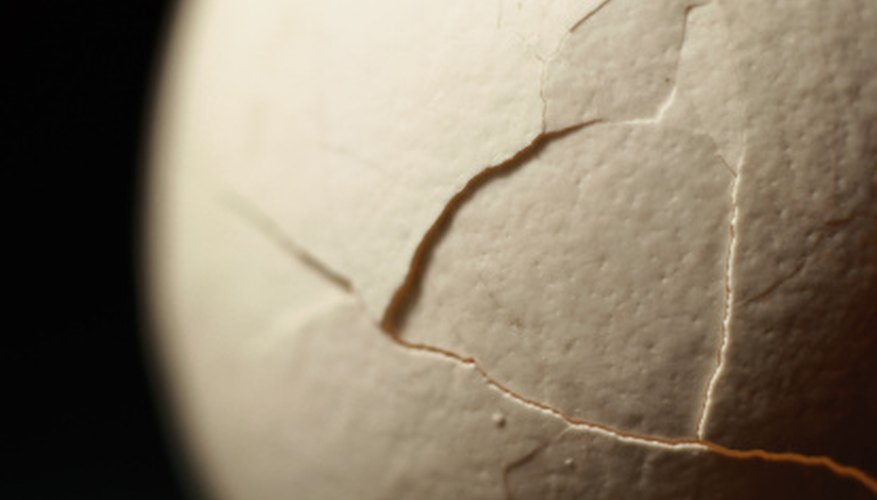 Photo Credit: Photodisc/Photodisc/Getty Images Make a container to prevent an egg from breaking when it is dropped.
