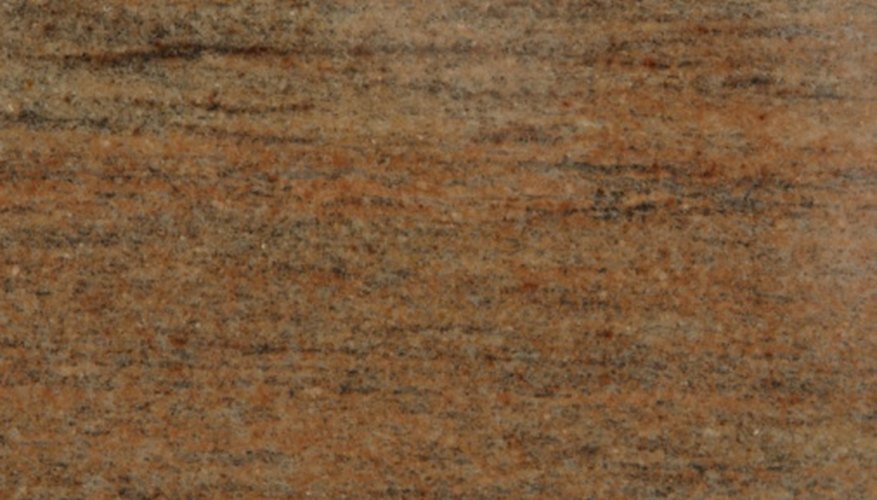 Photo Credit: Photos.com/Photos.com/Getty Images Individual minerals can be seen with the naked eye in a sample of sandstone.