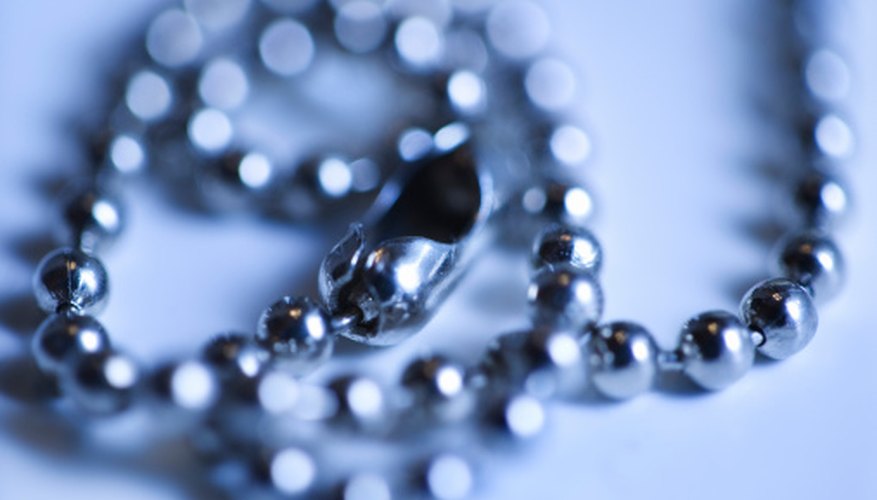 Photo Credit: Thinkstock/Comstock/Getty Images Zinc, copper, silver, iron and gold react with other elements to form chemical compounds with important industrial functions.