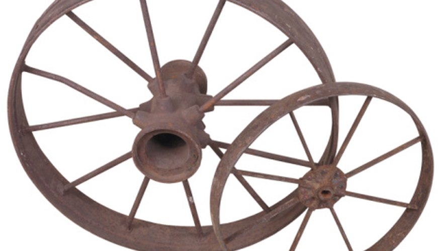 Photo Credit: Hemera Technologies/PhotoObjects.net/Getty Images A larger wheel travels farther at a set angular speed.